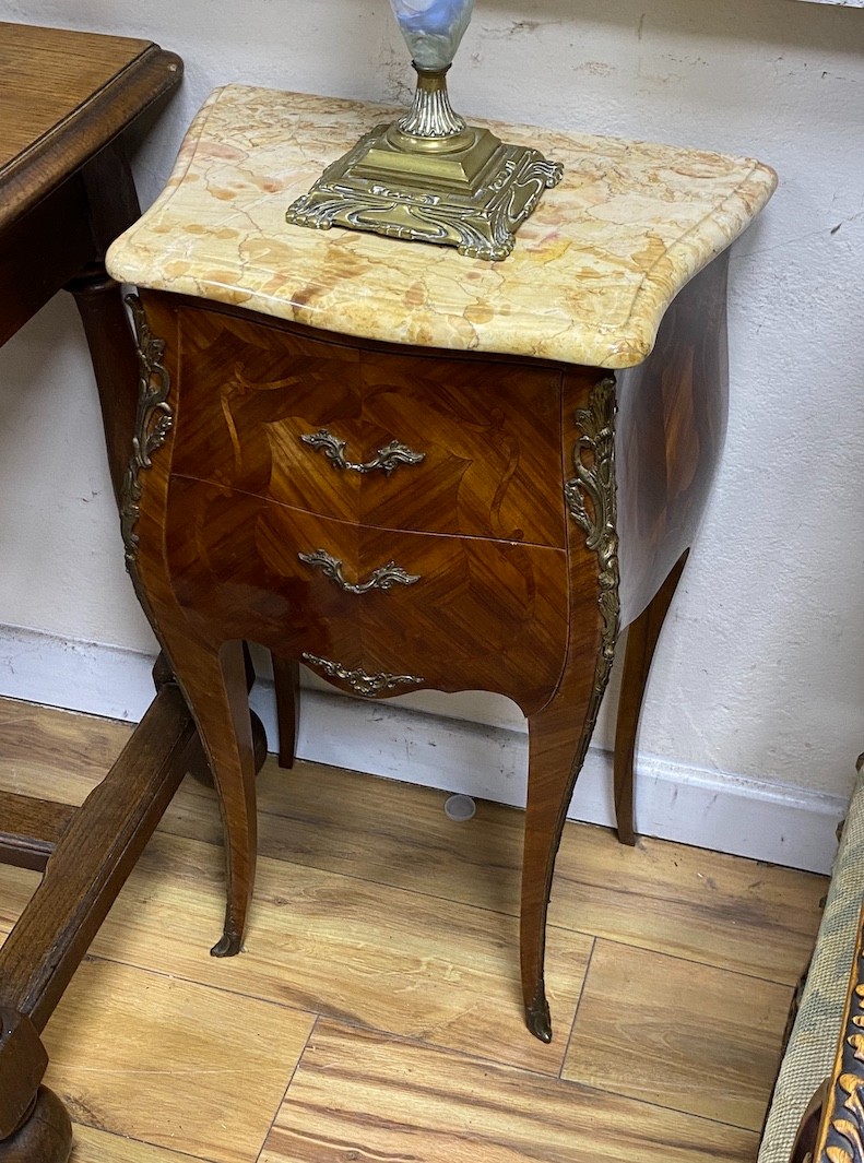 A pair of Louis XVI style marble top kingwood serpentine bombe bedside chests, width 42cm, depth 29cm, height 72cm